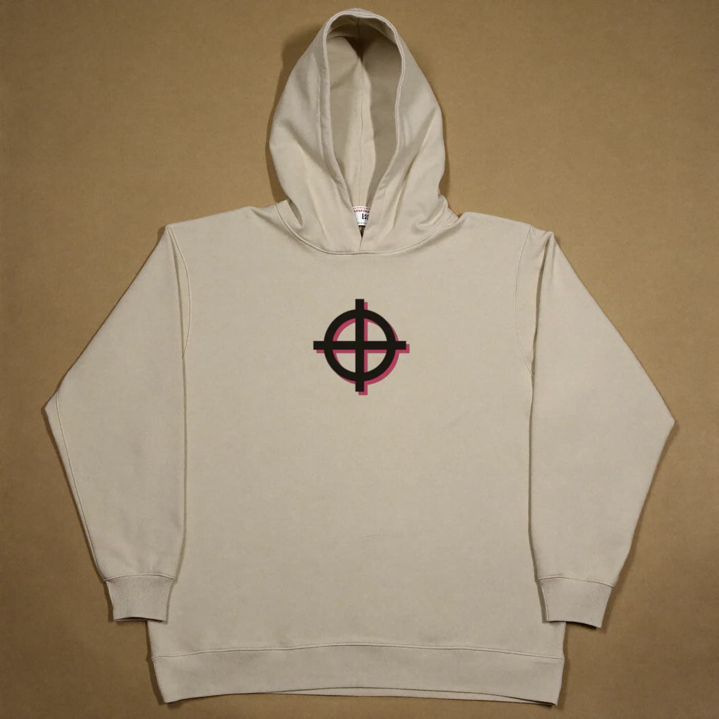A cream heavyweight cotton hoodie laid flat, with OTRO's off-register registration target printed on the chest